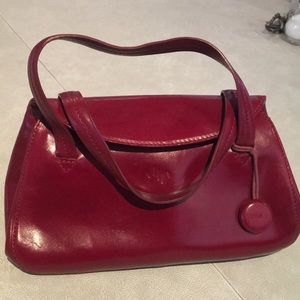 Cherry red Monsac purse. Light scuffing.